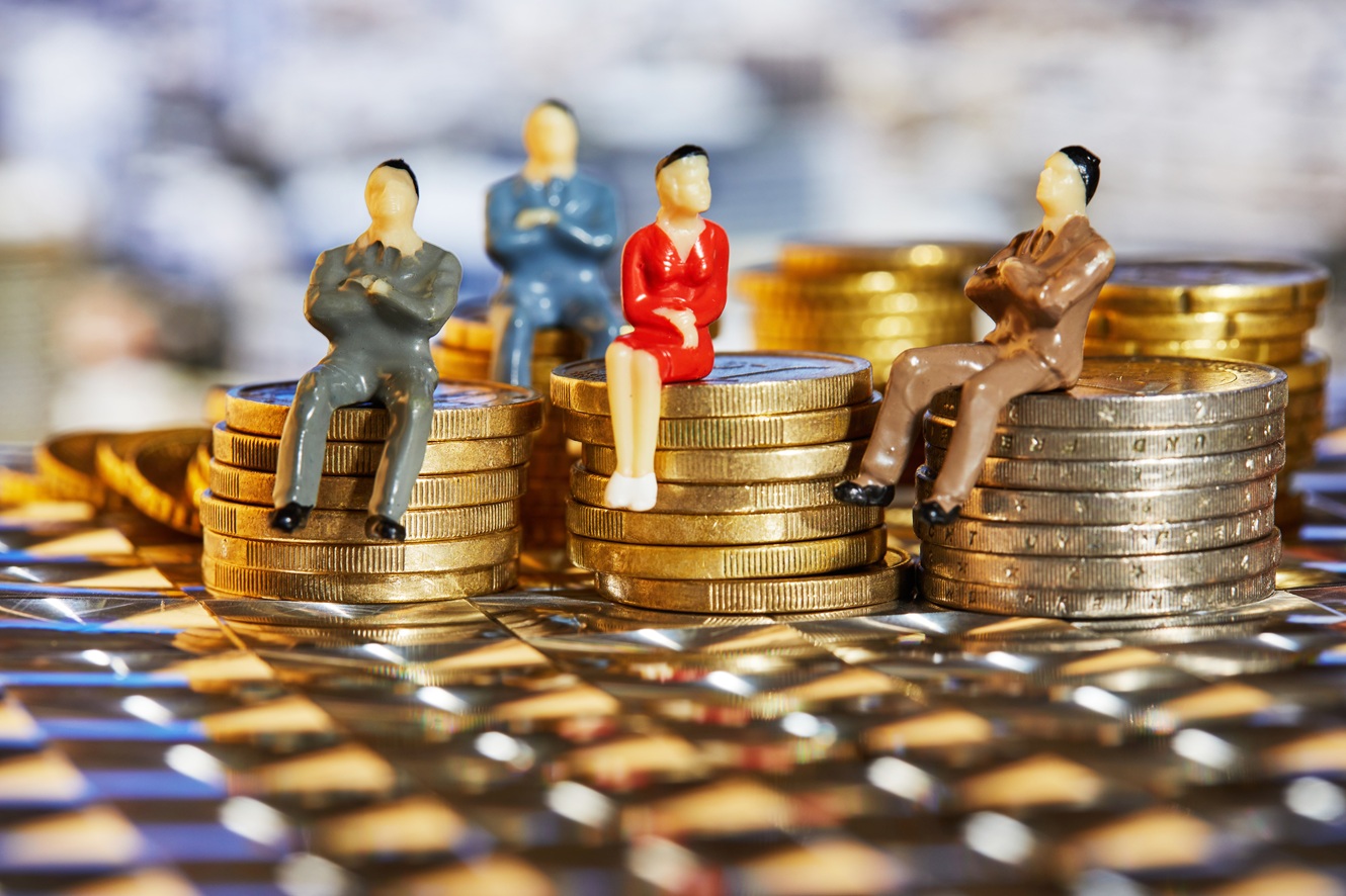 figures of investors sitting on coins