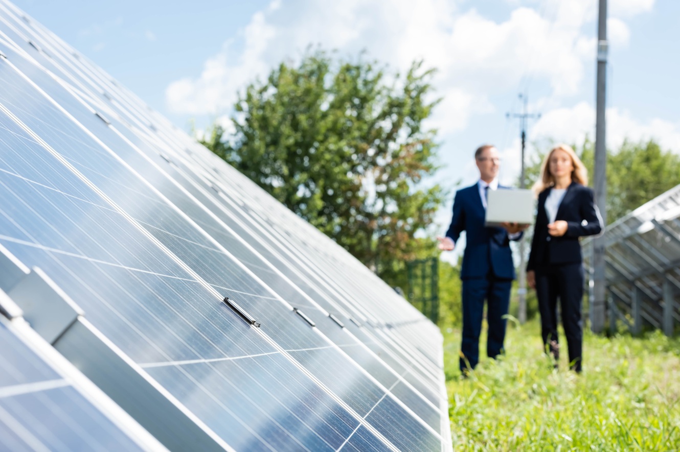 investors checking a solar energy farm