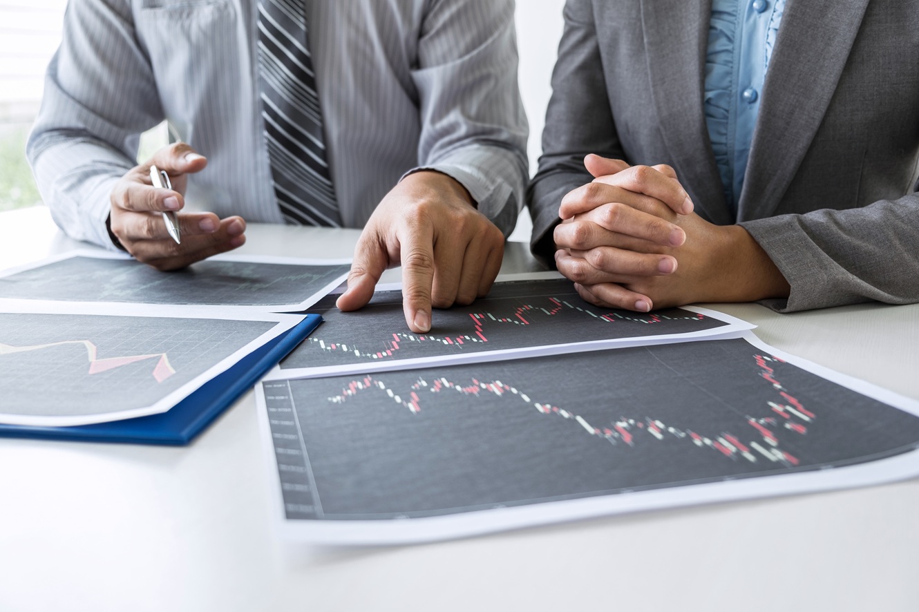 investors reviewing trends in investment performance data