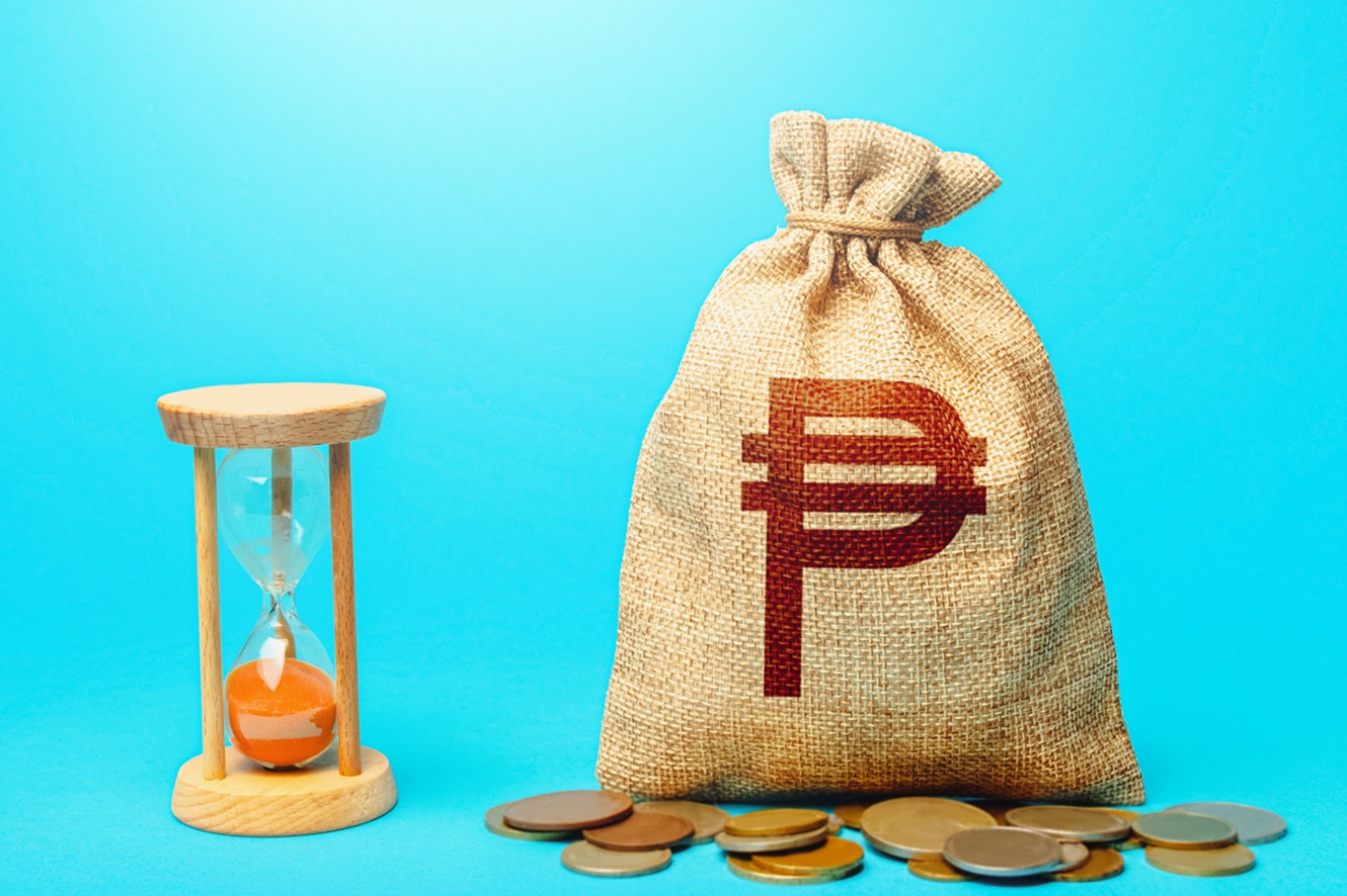 philippine peso money bag and an hourglass